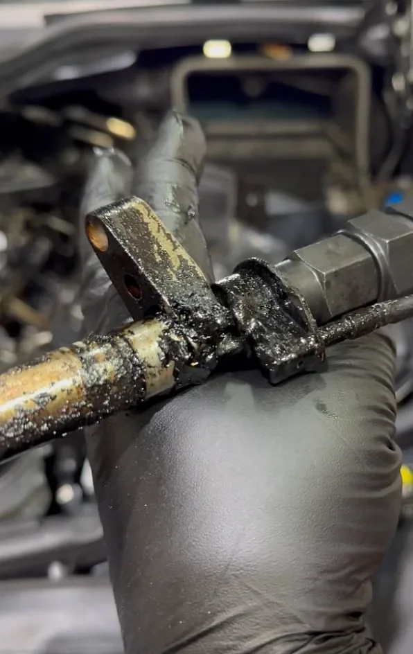 Mercedes-Benz ML 350D 2010 diesel injector removed during seat leak repair at StalexAuto